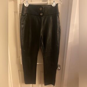 Leather pants with jewelled buttons